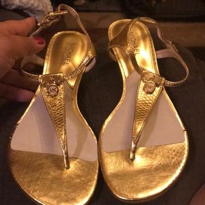 MK Gold t strap sandals.
